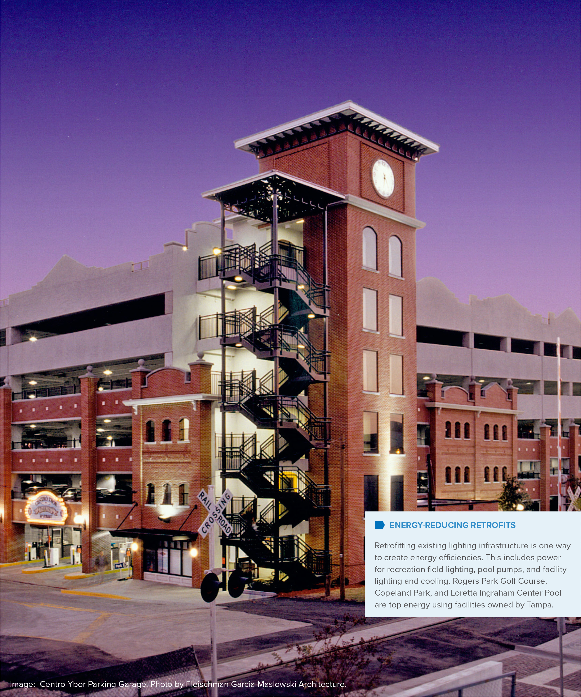 Parking garage with a modern design, featuring energy-efficient lighting and a prominent clock tower, set against a twilight sky.