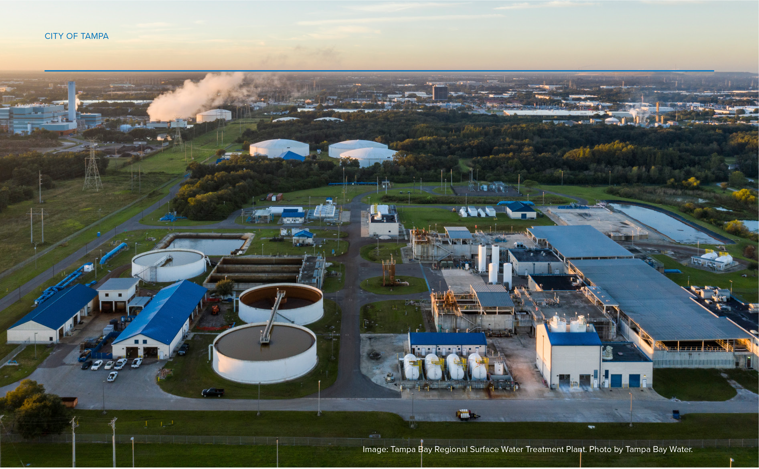 Aerial view of the Tampa Bay Regional Surface Water Treatment Plant, showing tanks, buildings, and vegetation in an industrial landscape.
