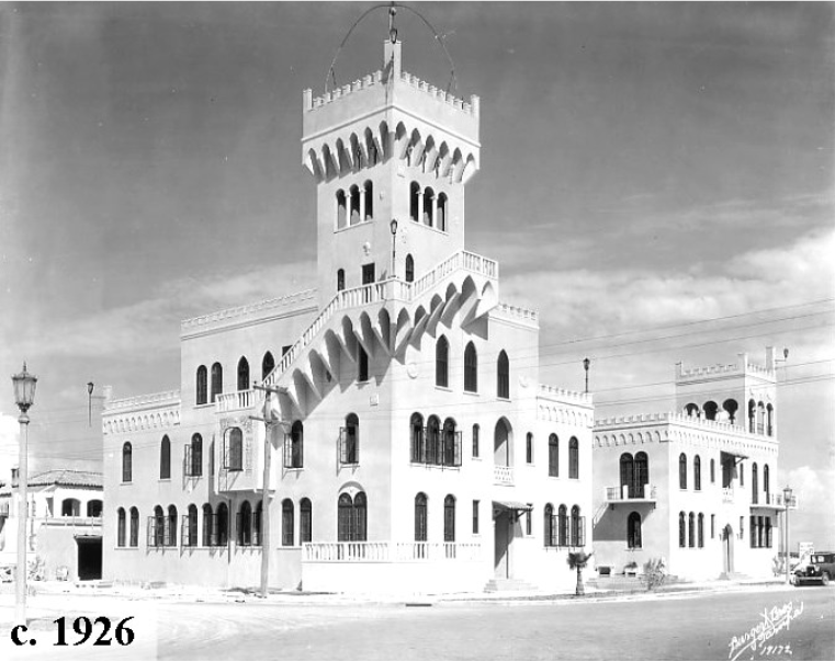 Historic black and white photograph of a castle-like building with a distinctive tower and staircase, taken around 1926.