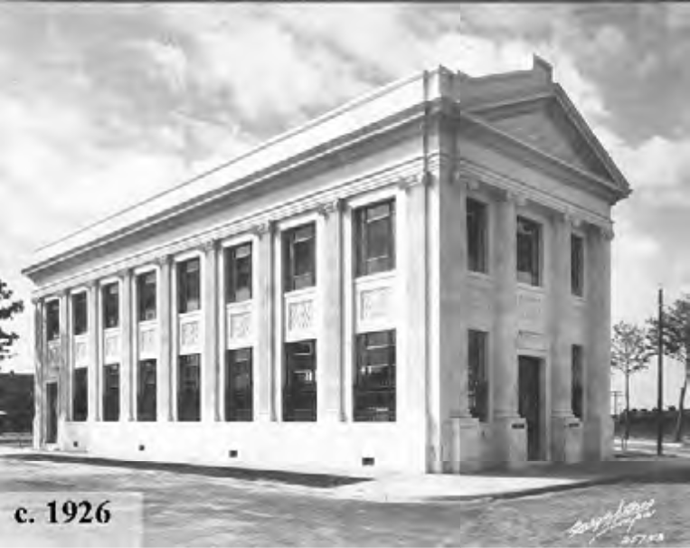 Historical black and white image of a neoclassical building with columns, dated c. 1926.