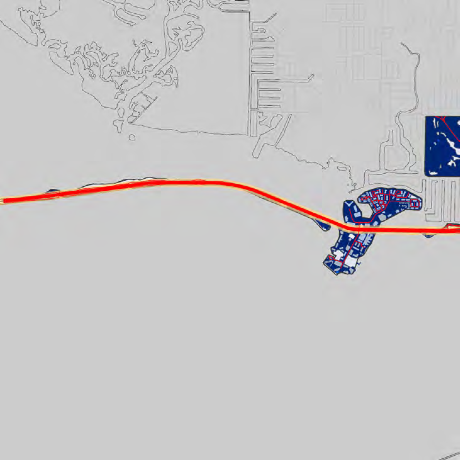 Map showing coastal geography with roadways and urban layout, highlighting land and water features in contrasting colors.
