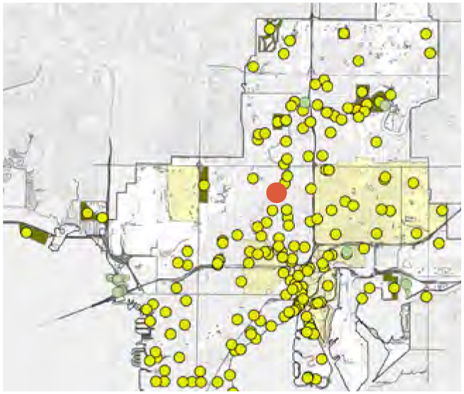 Map showing various yellow and red dots indicating locations, with geographic features and patterns visible in the background.