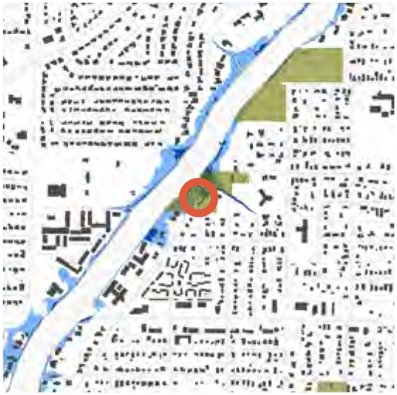 Map showing a river with marked location in the center, surrounded by grid-like streets and green areas.