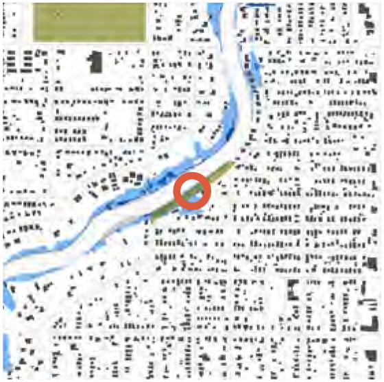 A map featuring waterways and urban layout, with a highlighted circular area indicating a specific location.