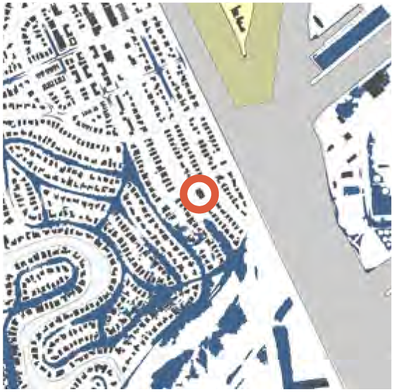 Map showing a residential area with marked location in the center, featuring roads and buildings.