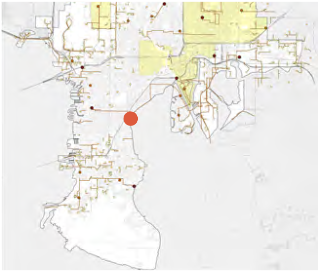 Map showing urban layout with highlighted sections and a marked location in orange, surrounded by a network of lines and points.
