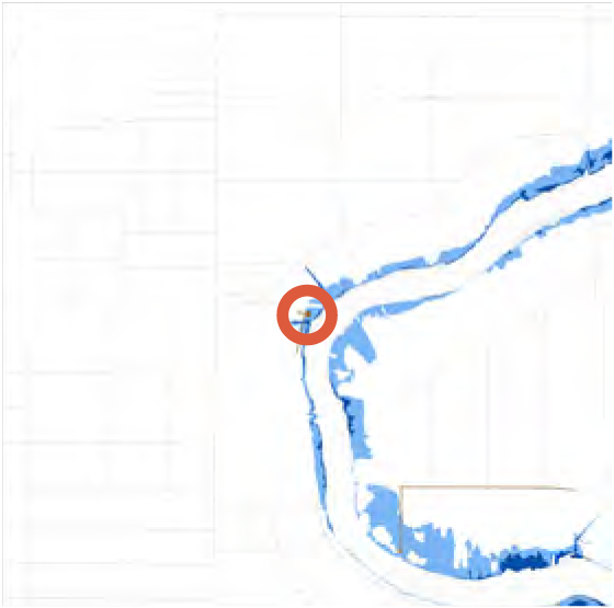 Map showing a river with a highlighted point of interest in an urban area.