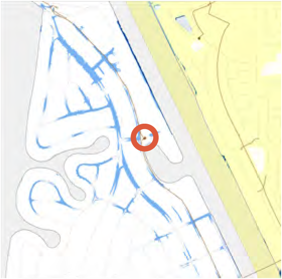 A map displaying winding blue lines representing roads or water, with a red circle marking a specific location.