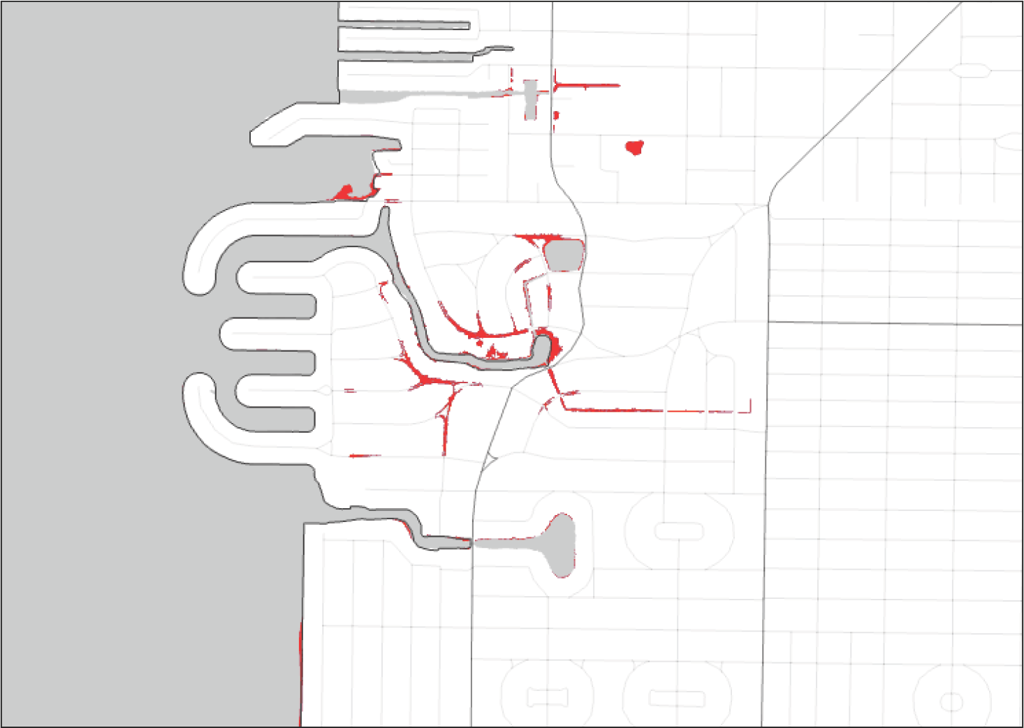 A schematic map displaying a network of roads and pathways, highlighted in red against a gray background.