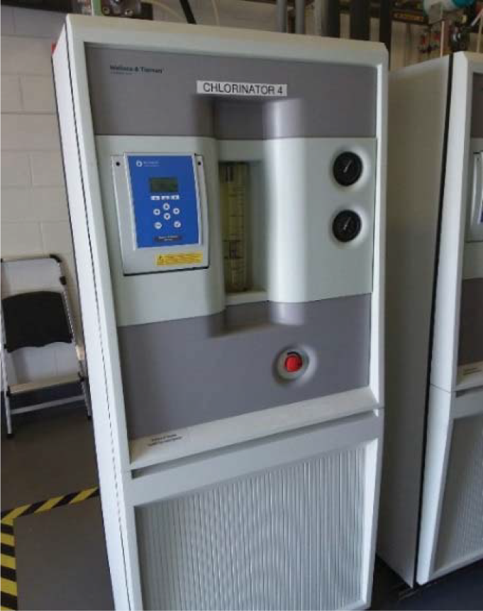 A chlorinator machine labeled 'CHLORINATOR 4' with digital controls and indicators, situated in a technical environment.