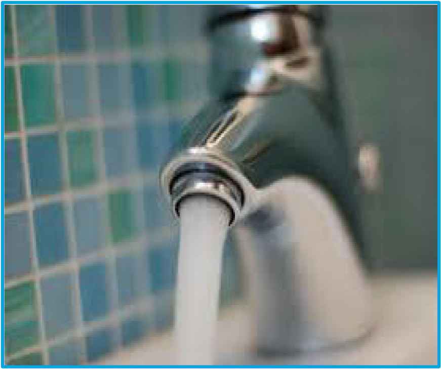 Close-up of a chrome faucet with water flowing from it against a mosaic tile background.